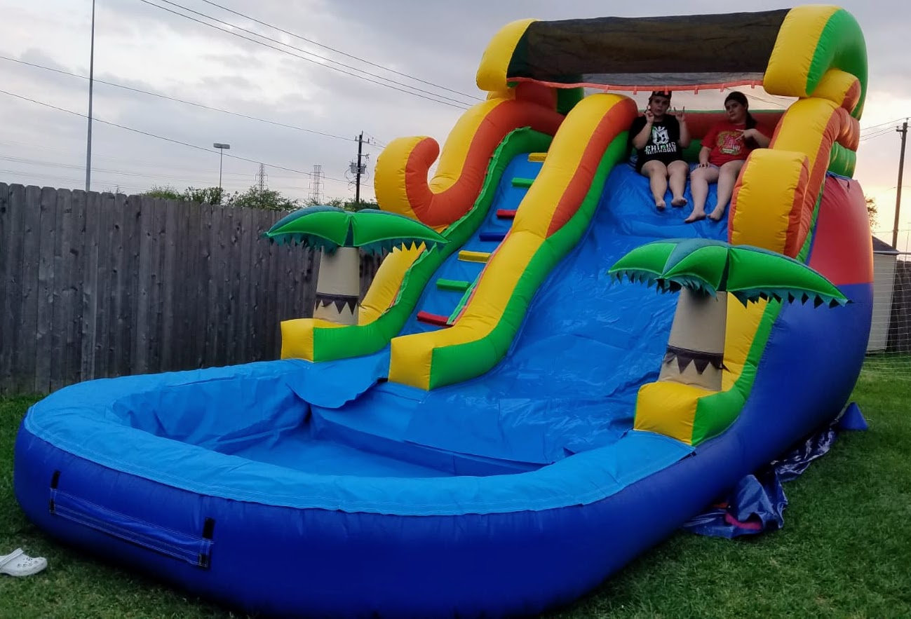 Water slide moonwalk with palm trees